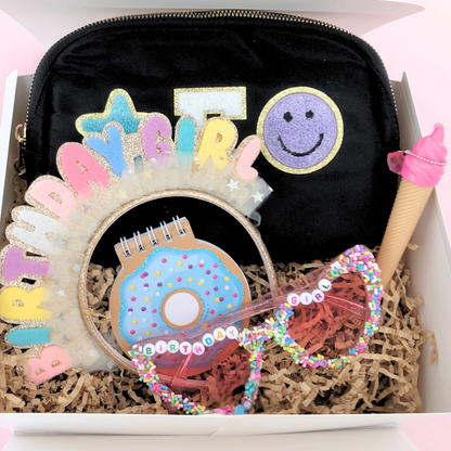 Black gift box set – Black fanny pack with patches, “Birthday Girl” headband, sprinkle sunglasses, and accessories in a kraft box.