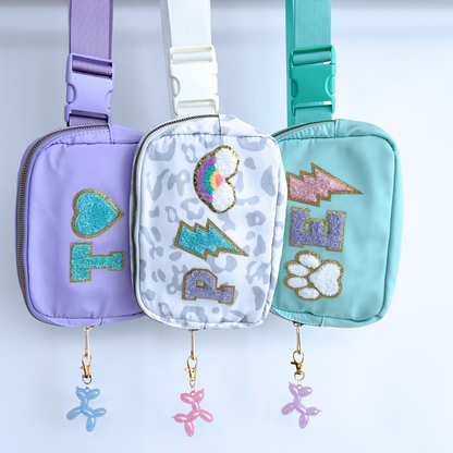 Three colorful pouches with decorative elements on a light blue background