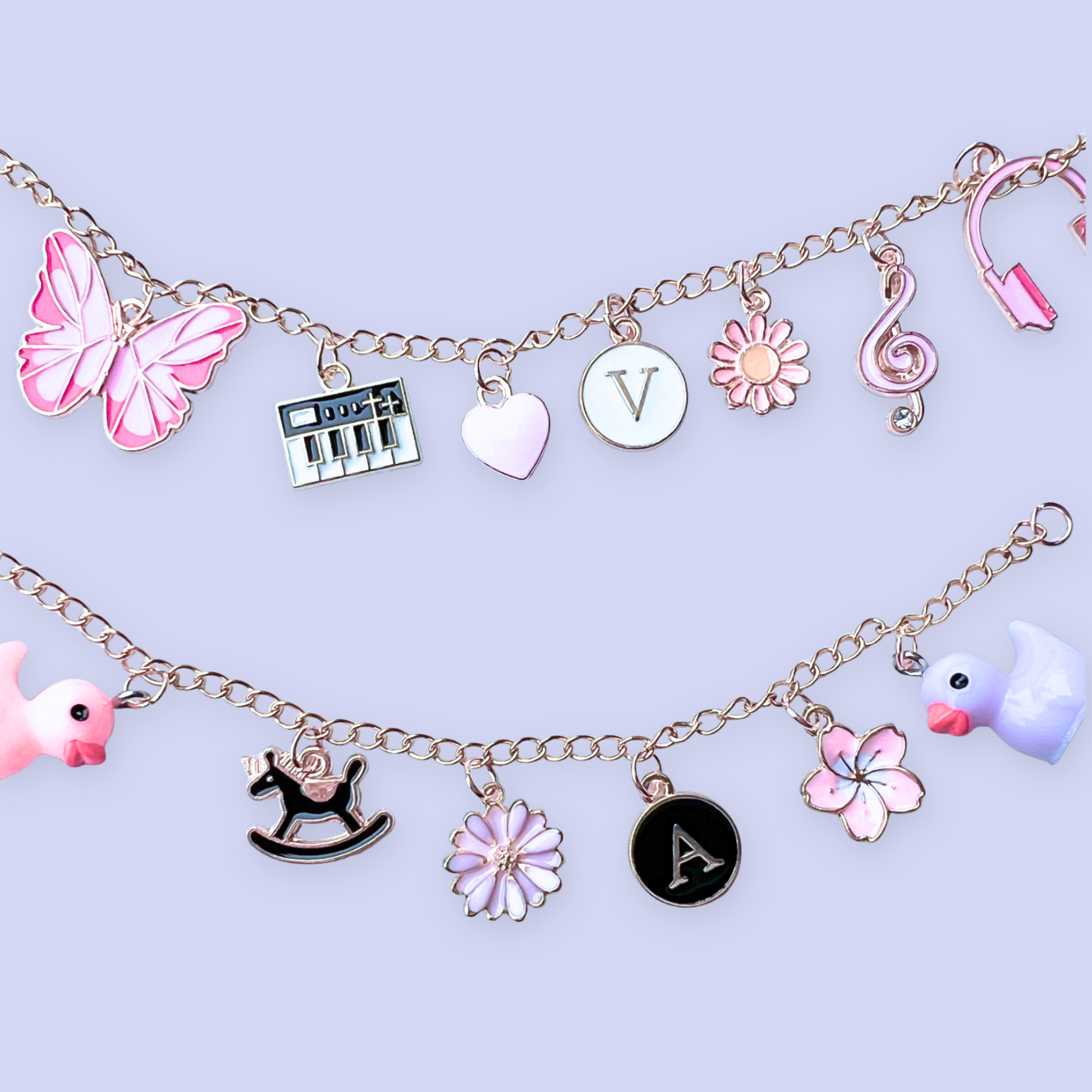 Bracelet with various charms including butterflies, flowers, and letters on a light purple background
