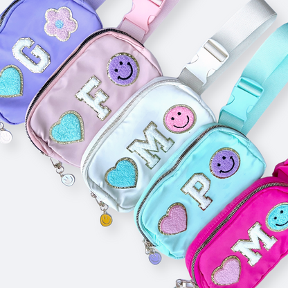 Multiple fanny packs laid out showing patch variations