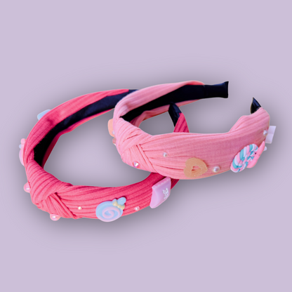 two pink headbands with cute candy charms and pearl rhinestones
