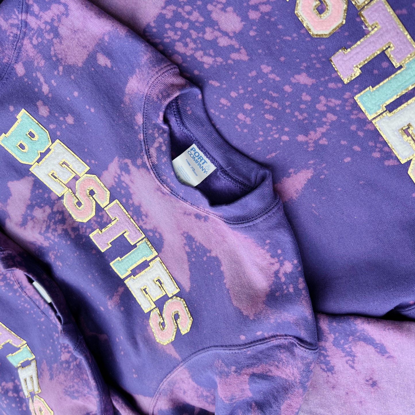 Purple tie-dye hoodie with 'BESTIES' text on a matching background