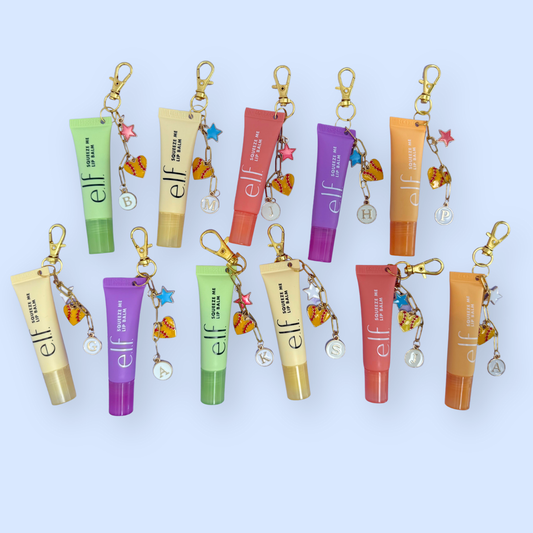 Set of e.l.f. cosmetic tube keychains on a light blue background