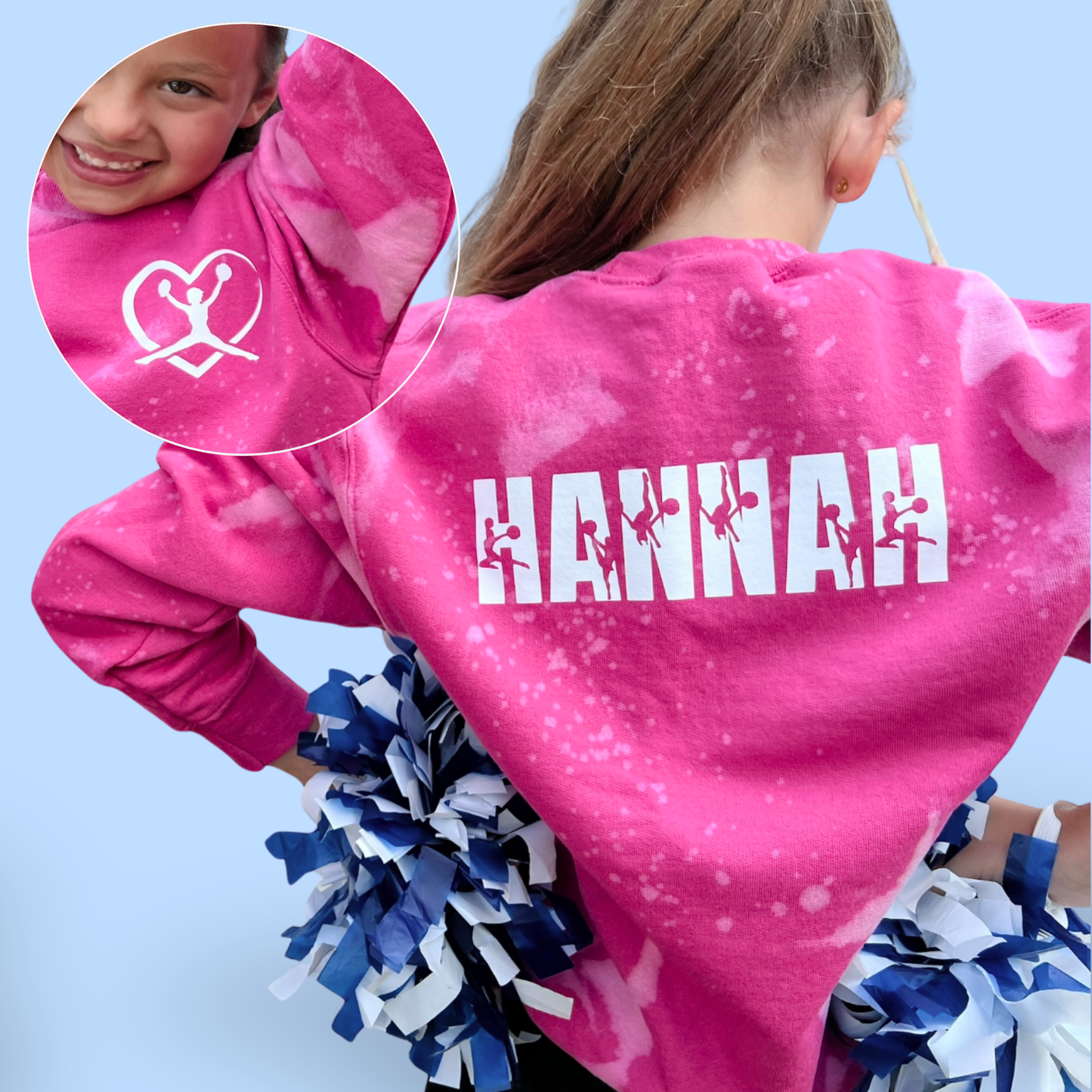 Pink tie-dye sweatshirt with 'HANNAH' printed on the back, worn by a person with pom-poms.