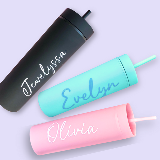 Three tumblers - black, teal, pink):
Three personalized 16oz tumbler cups with straws, shown in black, teal, and pink with custom names “Jewelyssa,” “Evelyn,” and “Olivia.”